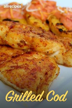 grilled chicken on a white plate with red peppers