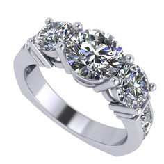 three stone engagement ring with diamonds on the sides