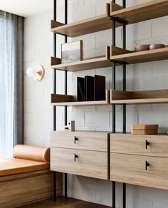 an empty room with shelves on the wall