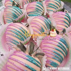 there are many pink and blue strawberries on the plate with green sprinkles