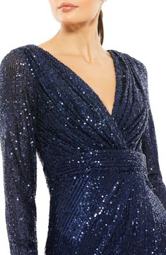 Lustrous sequins elevate this glamorous dress designed with a deeply dipped neckline and a stem-showing side vent. 41" length Hidden back-zip closure Deep V-neck Long sleeves Side slit Lined 100% polyester Spot clean Imported Asian Owned/Founded Robes Glamour, Long Sleeve Evening Gowns, Long Sleeve Sequin Dress, Sequence Dress, Long Sleeve Cocktail Dress, Unique Prom Dresses, Glamorous Dresses, Sequin Cocktail Dress, Long Sleeve Sequin