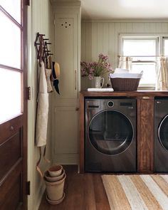 a washer and dryer in a small room