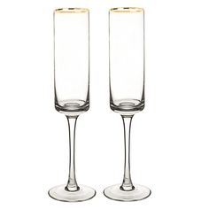 two champagne flutes sitting next to each other