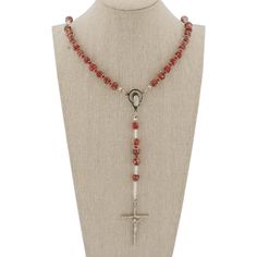 This Murano Glass Rosary Necklace features beautiful red sparkly beads and a silver-plated crucifix handcrafted by the skilled master glass-makers in a family-owned workshop on Murano island in Venice, Italy. The rosary necklace is created by hand using ancient glass-making tools and techniques. This is a beautiful religious gift with an Italian flair that will be uniquely appropriate for a special occasion. Measurements: Full Length is 27 inches. The length from the centerpiece to the bottom of Crucifix Jewelry With Faceted Beads For Gift, Crucifix Shaped Jewelry With Faceted Beads As Gift, Crucifix Jewelry With Faceted Beads As Gift, Red Czech Glass Spiritual Jewelry, Artisan Red Czech Glass Jewelry, Handmade Red Cross Pendant Jewelry, Handmade Red Crucifix Jewelry, Handmade Red Cross Jewelry, Red Spiritual Cross Pendant Jewelry