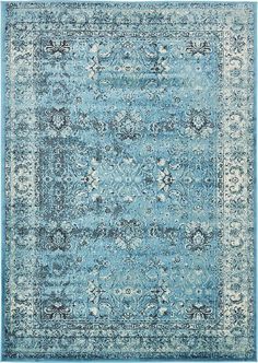 a blue and white rug with an ornate design