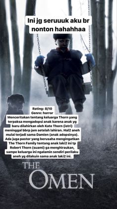 the omen movie poster with an image of a man sitting on a swing in the woods