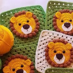 crocheted squares with teddy bears on them and balls of yarn in the background