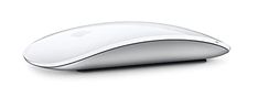 an apple mouse sitting on top of a white surface