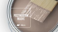 a paint can with a brush in it that says postmodery mauve