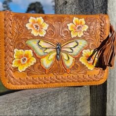 New For Boutique! Amazing Hand Crafted Wallet Made By A Trusted Team Of Artisans That Pride Themselves On Making Slow Fashion And Eco-Sourcing. Nothing On Wallet Is Machine Made. The Leather Used Is A Bi-Product Of The Food Industry, So Eco-Sourced. The Tan Wallet Features A Hand Tooled, (Carved To Give Dimension) Hand Painted Yellow Butterfly Surrounded By Flowers, Swirls And Hand Stitched Leather On The Border. Nonsmoking Home. Inside Features: Mirror, Zippered Coin Purse, Driver’s License Slo Yellow Wallet With Removable Pouch For Daily Use, Yellow Leather Travel Wallets, Yellow Pouch Wallet For Everyday Use, Yellow Leather Wallet For Everyday Use, Yellow Leather Clutch For Everyday Use, Yellow Rectangular Wallet With Removable Pouch, Handmade Leather Bifold Bag, Multicolor Leather Pouch Wallet, Yellow Leather Rectangular Wallet