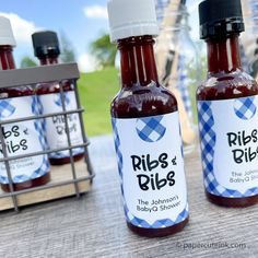 barbecue baby shower favors on a picnic table Bbq Favors, Blue Gingham Bbq Party, Fancy Backyard Bbq, Baby Shower Bbq Decorations, Babyque Shower Ideas Boy, Bbq Sprinkle Shower Ideas, Bibs And Ribs Baby Shower Ideas, Gender Reveal Ideas Bbq