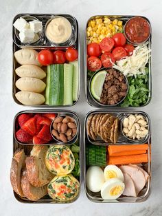 four trays filled with different types of food and veggies on top of each other