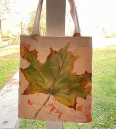 a bag with a leaf painted on it