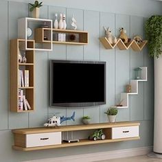 a flat screen tv mounted to the side of a wooden entertainment center in a living room