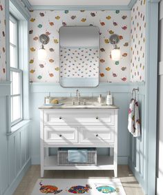 a bathroom with blue walls and white furniture