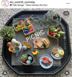 a tray that has some food on top of it with the words picnic spelled in large letters