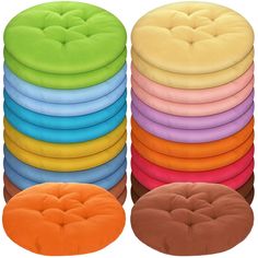 a stack of multicolored round cushions sitting next to each other