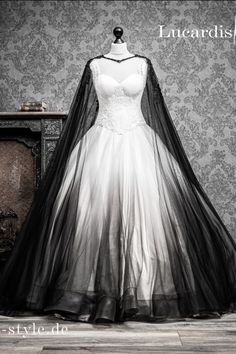 a black and white wedding dress on display