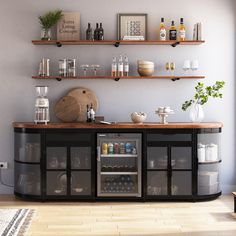 a kitchen area with shelves filled with bottles and glasses