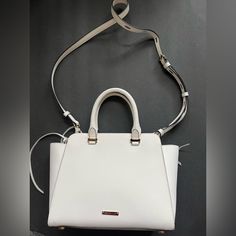 Rebecca Minkoff Leather Tote Designer White Satchel With Gold-tone Hardware, White Leather Top Handle Shoulder Bag, Everyday White Satchel, Chic White Office Bags, White Satchel With Gold-tone Hardware, White Leather Satchel With Removable Pouch, White Leather Satchel Shoulder Bag, Modern White Shoulder Bag With Double Handle, White Leather Everyday Satchel