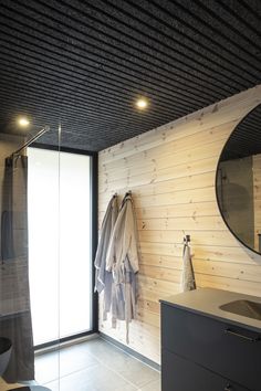 a bathroom with wooden walls and flooring