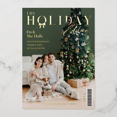 a holiday card with an image of two people sitting next to a christmas tree