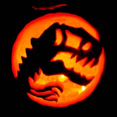 a carved pumpkin with an image of a dragon on it