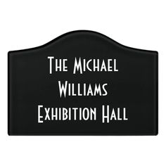 a black sign that says the michael williams exhibition hall