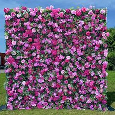 a large flowered wall in the middle of a field