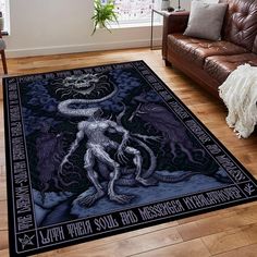 a living room area with a couch, chair and rug on the floor that has an image of a demon