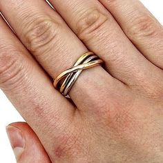 Our 14K tri-color yellow, white, and rose gold crossover trinity stackable ring is a breathtaking piece of jewelry that represents unity, love, and eternity. The three interlocked bands of gold symbolize the connection between past, present, and future, making this ring an ideal choice for a sentimental gift or a meaningful addition to your jewelry collection. The elegant and versatile design is perfect for stacking with other rings or wearing on its own, making it a versatile choice for any occasion. Expertly crafted with the highest standards of quality, this ring is a true testament to beauty and durability. Celebrate the power of connection with our stunning tri-color crossover trinity stackable ring. Product Specifics All specifications are approximate and may vary for the same model. Trinity Ring Stack, Trinity Ring, Europe Fashion, Stackable Ring, Sentimental Gifts, Stackable Rings, White Rose, Tri Color, White Roses