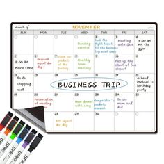 a dry erase calendar with markers and markers