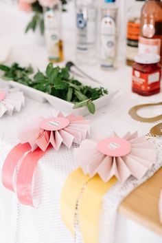 flowers and ribbons on a table at a party