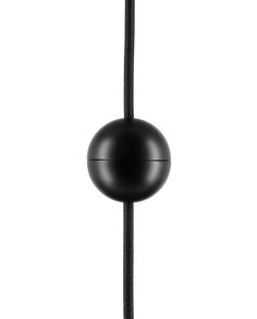 a black object is hanging on a rope