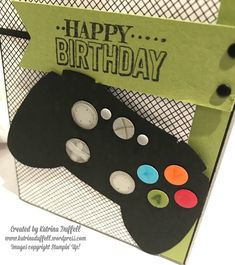 a close up of a birthday card with a video game controller in the middle and words happy birthday on it