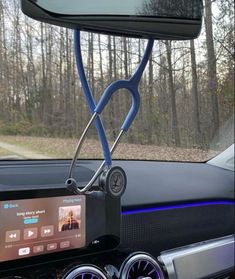 a car dashboard with an mp3 player attached to it