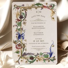 a wedding card with an ornate design on it