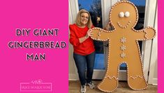 a woman standing in front of a gingerbread man cut out of cardboard with the words diy giant gingerbread man on it