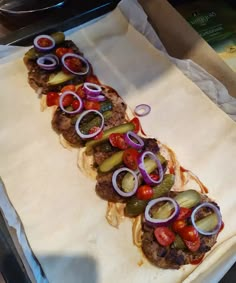 a tray with some food on top of it and onions, peppers, onion, and meat