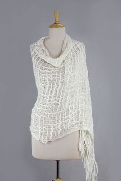 From Sandeep Malhotra this novel shawl is trendy and lightweight. Ivory yarns in varying thicknesses flow together in a voluptuous open weave wrap. White Shawl For Spring, One-size White Shawl For Summer, White One-size Wrap, White One Size Wrap, One Size White Wrap, White Shawl Wrap Scarf, Spring White Shawl Dupatta, White One-size Shawl Wrap, White Dupatta For Spring