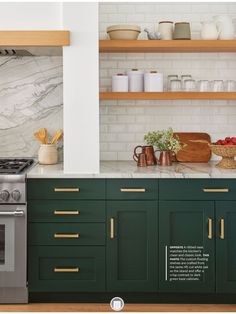 a kitchen with green cabinets and marble counter tops