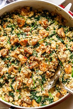 a large pot filled with rice and vegetables