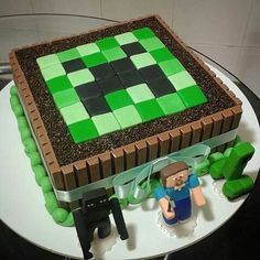 a cake made to look like a minecraft creeper with green and brown decorations