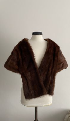 Vintage  1940s /1950s brown mink fur stole,wrap style with long front, lined with silk satin, sits on the shoulders and drapes across the back in the prettiest way!  ✂-----Measurements : length back  14" lg front 25" brand/maker: n/a condition: excellent, no drying, tears or shedding Shipping Is Avaliable Worldwide. Every item is carefully shipped Priority via Air Mail - shipping takes from 7 to 14 working days, depending on your location. Shipping includes Tracking. Come and check out our shop 1950 Style, Fur Wrap, Fur Stole, Brown Fur, Mink Fur, Shawls And Wraps, Silk Satin, Chocolate Brown, Wrap Style