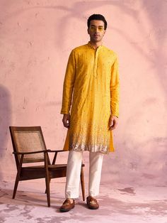 SHRESTHA By VASTRAMAY Men's Yellow Georgette Zari With Sequins Worked Kurta pant Set Elevate your traditional wardrobe with the exquisite SHRESTHA By VASTRAMAY Men's Yellow Georgette Zari With Sequins Worked Kurta Pant Set. Crafted with meticulous detail, this set combines classic elegance with contemporary style, perfect for festive occasions and special events. Features Elegant yellow georgette fabric Intricate zari and sequins work Comfortable fit with stylish design Ideal for festive and spe Traditional Yellow Pants For Festive Occasions, Fitted Yellow Bottoms For Festive Season, Fitted Yellow Bottoms For Festive Occasions, Traditional Yellow Bottoms For Festive Occasion, Traditional Wardrobe, Kurta Pant Set, Kurta With Pants, Georgette Fabric, Sleeveless Jacket