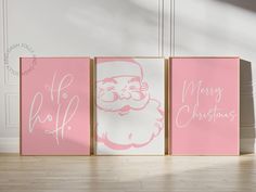 three pink and white canvases with santa claus on them