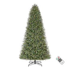 a christmas tree with lights and remotes next to it on a white background,