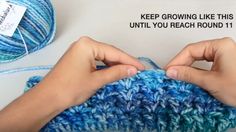 someone crocheting a blue and white afghan with text that reads, keep growing like this until you reach round 11