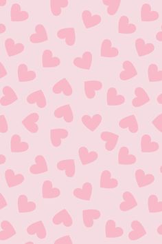 pink hearts on a light pink background for valentine's day greeting card or wallpaper