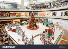 an indoor christmas tree in the center of a shopping mall